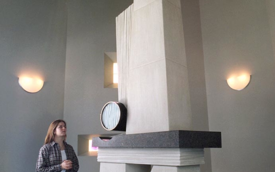 The Blessed Sacrament Chapel houses a 13-foot high limestone tabernacle with a bronze cylinder, which hovers over a granite shelf and holds the consecrated bread reserved for communion services and Viaticum.